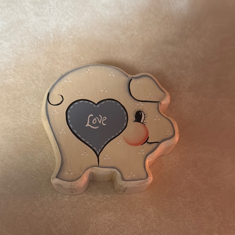 Wooden pig with love heart